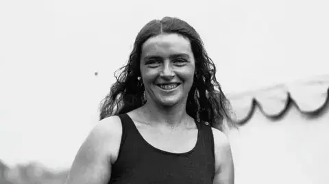 Mercedes Gleitze Mercedes Gleitze, the first British woman to swim the English Channel in 1927, and an iconic figure in the history of Rolex Oyster waterproof development.